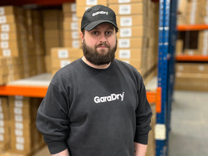 Photo of Adam King, a warehouse operative inside the GaraDry warehouse