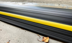 Close up of the 50mm garage door flood barrier Garadam after rainfall showing it stayed clean