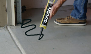 GaraDry adhesive and sealant being applied on the garage floor